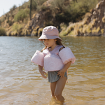 pink floaties and bucket hat