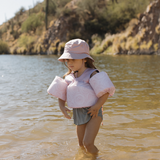 pink floaties and bucket hat