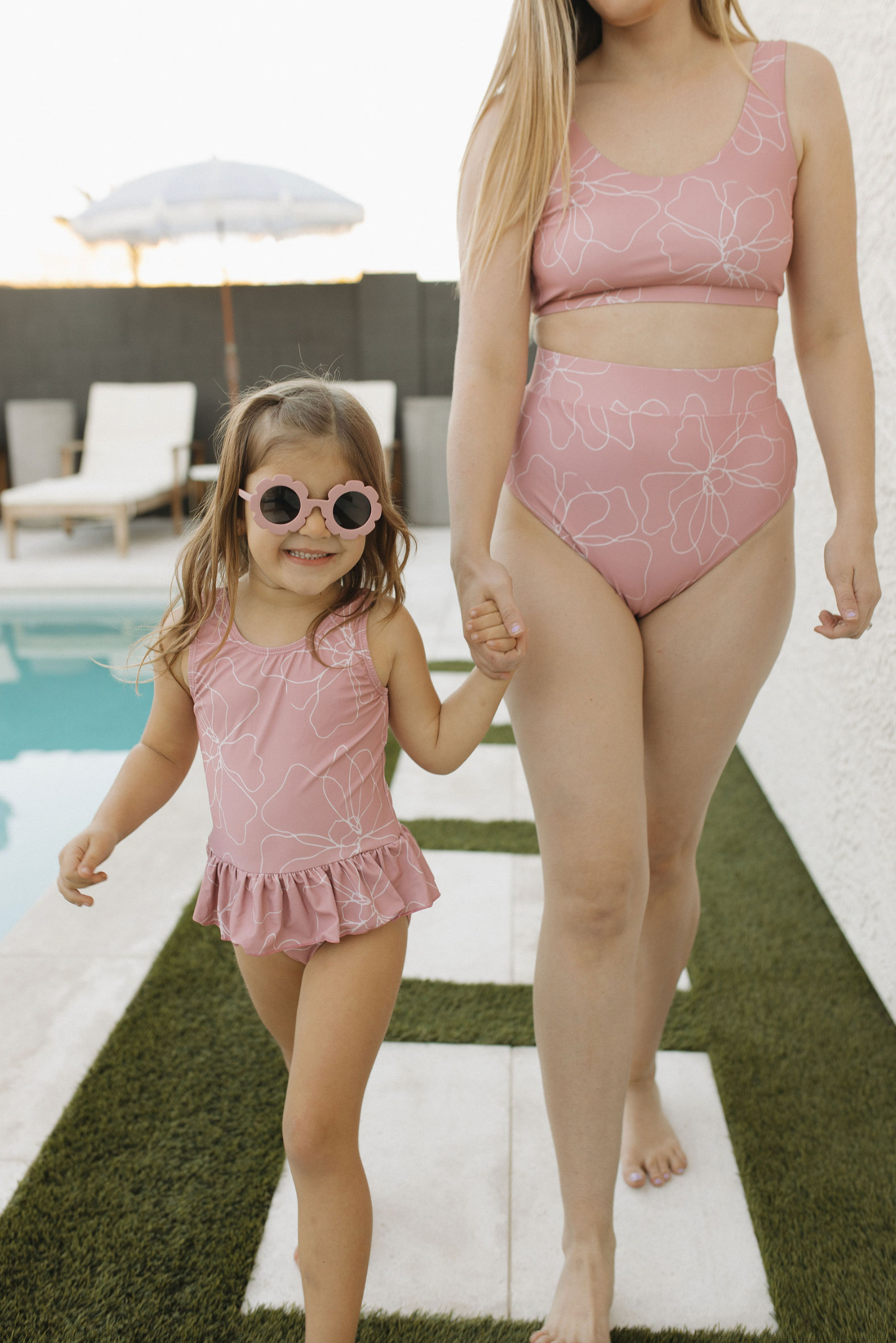 mom and girl matching pink swimwear